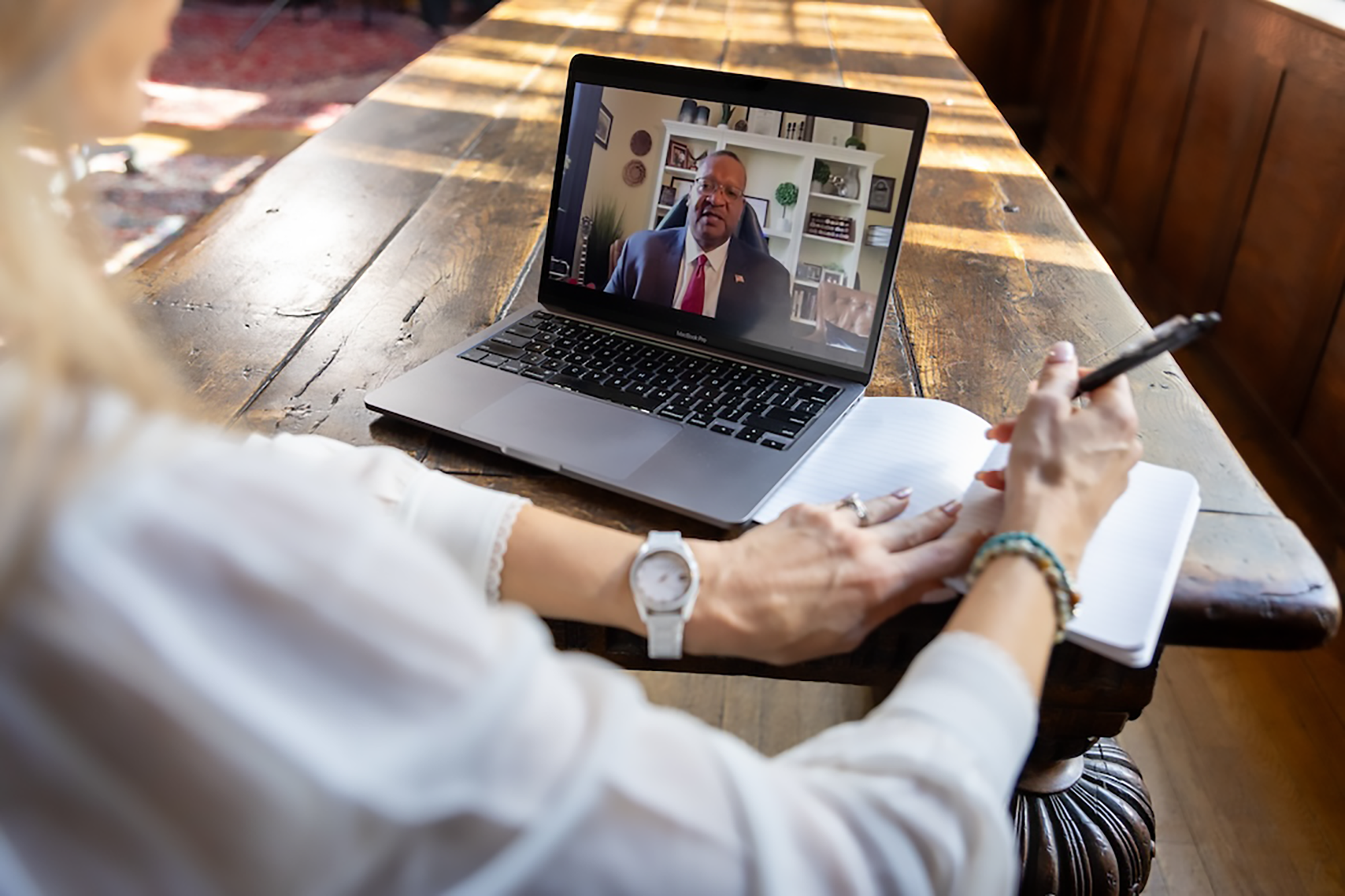 Over the shoulder photo of person attending an online training course with the Federal Employment Law Training Group.