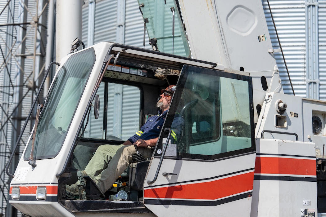 Top Bead Welding employee driving a crane